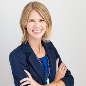 Professional headshot portrait of a beautiful, smiling business woman.